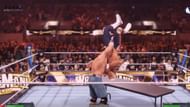 Perform Attitude Adjustment on the table (Image via 2K Games || YouTube/EspacioNX)